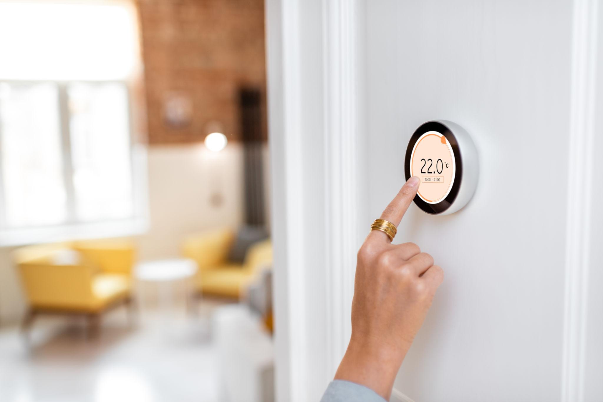 thermostat and living space representing energy efficiency over time