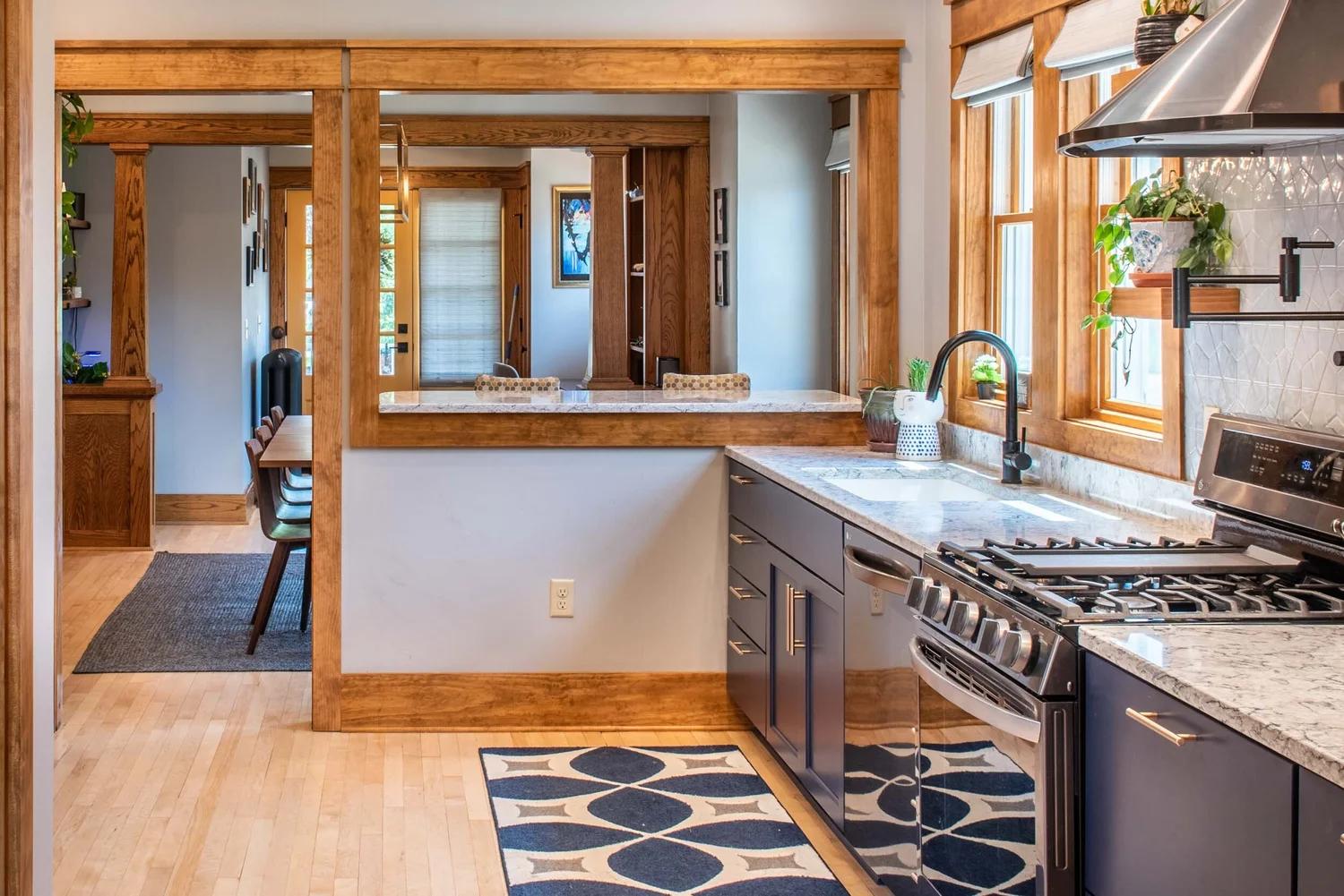 Floor-level kitchen view highlighting the living space above hidden plumbing systems.