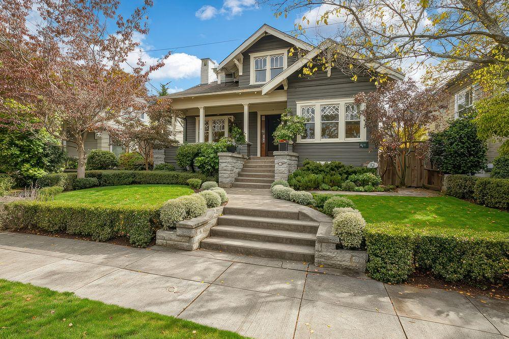 Clear residential foundation with well-maintained fall landscaping.