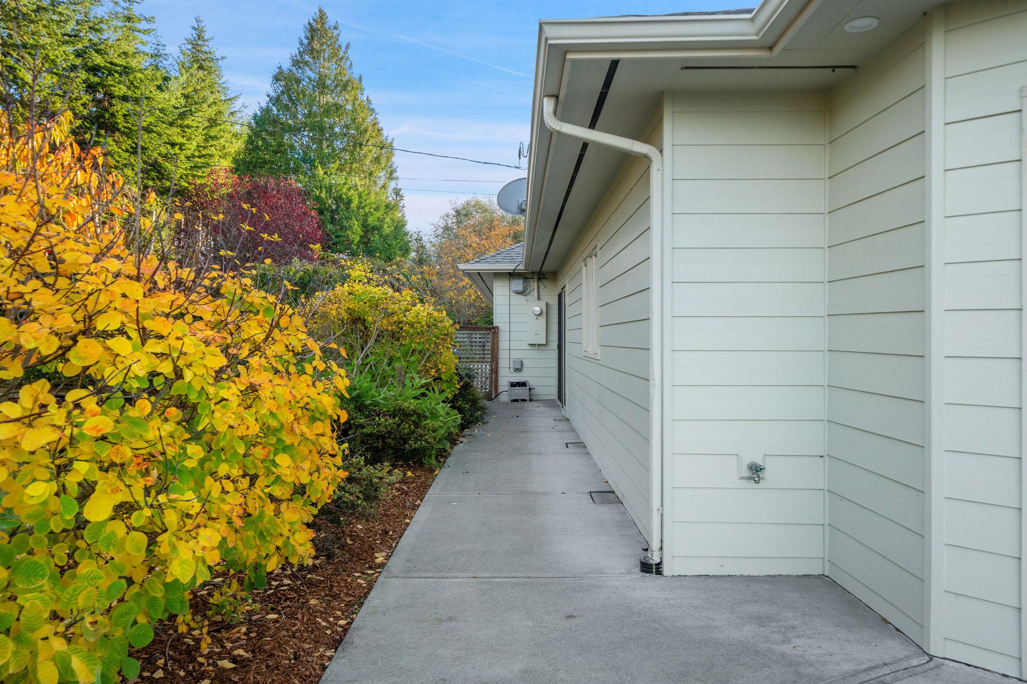 Clear landscaping along a residential foundation allowing easier inspection of drainage conditions