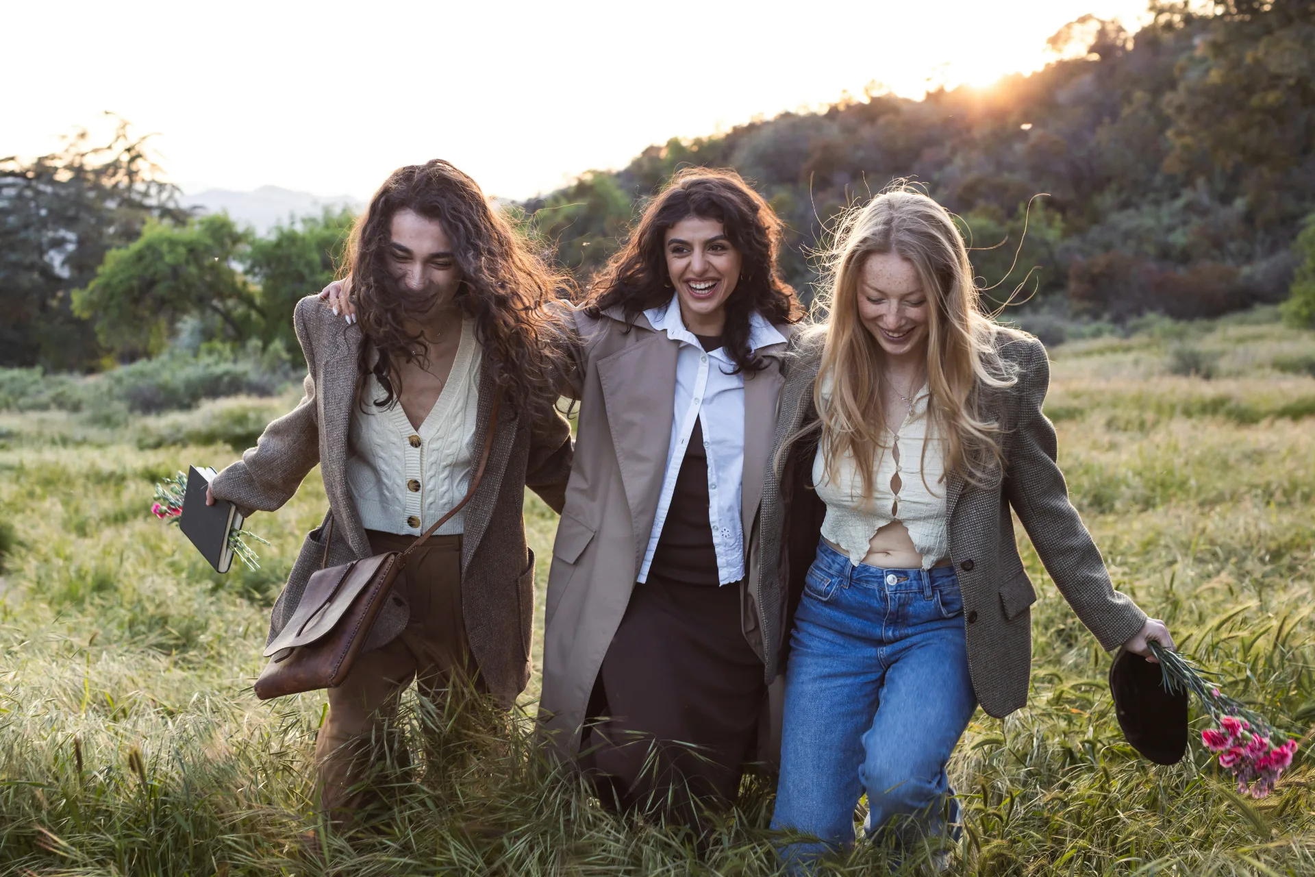 Three friends walking together outdoors