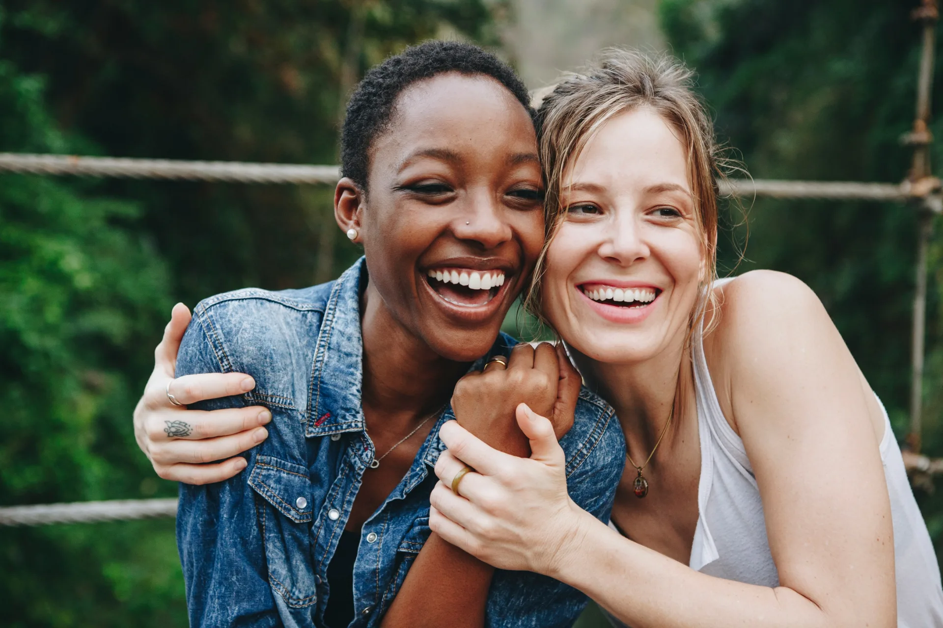 Two happy women hugging and smiling