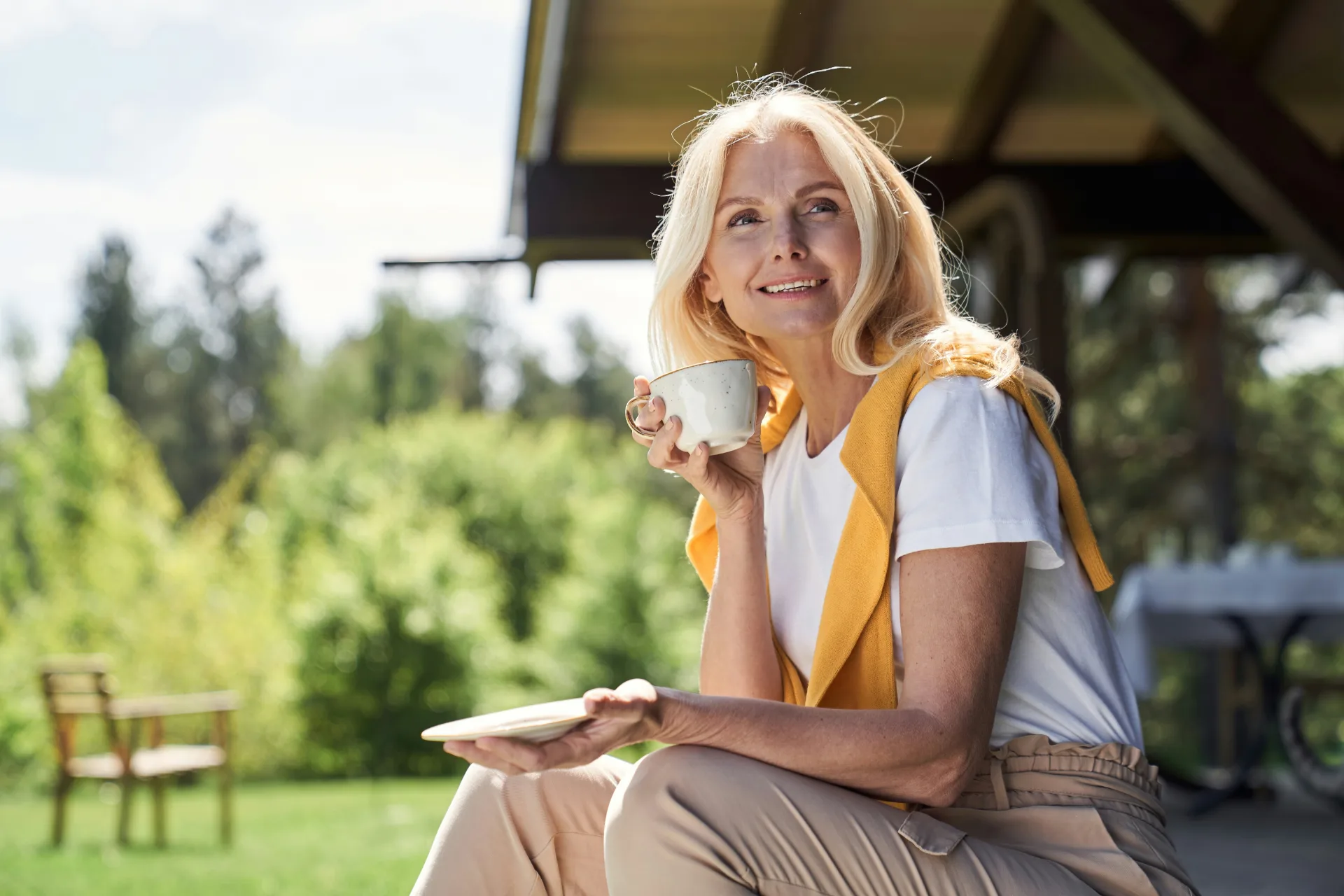 Smiling woman enjoying a calm morning outdoors