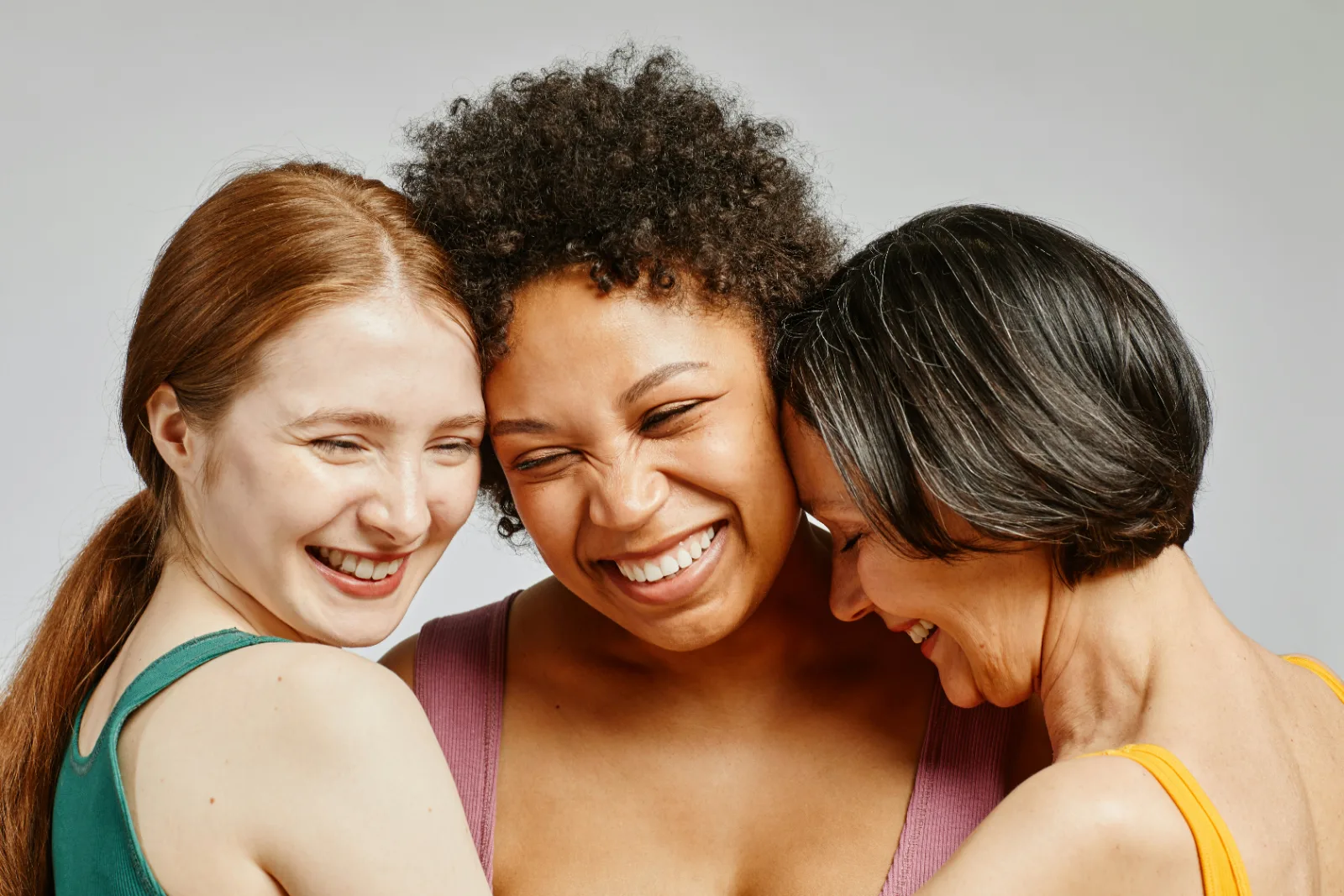 Three women laughing together