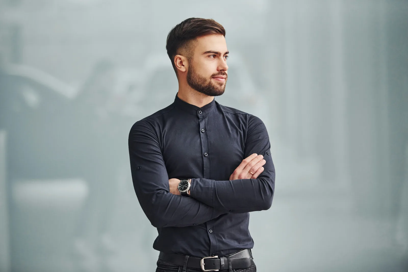 Confident bearded man with arms crossed
