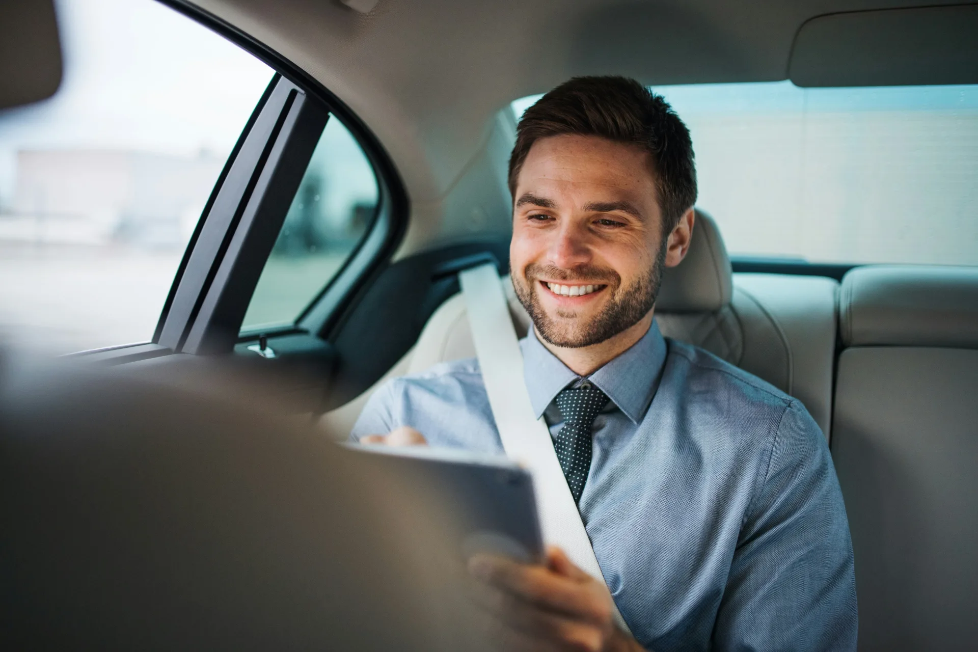 Man booking an appointment on his tablet