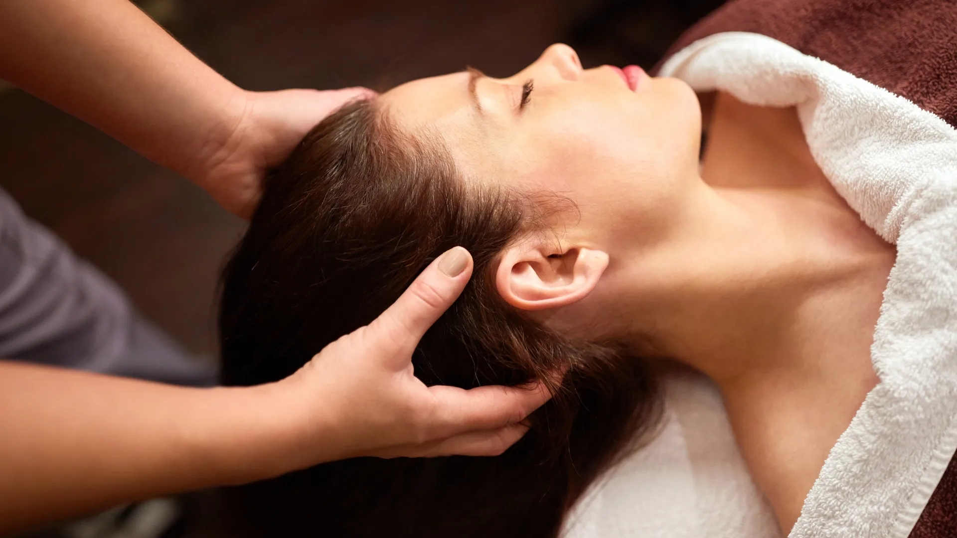 Head massage during a head spa treatment