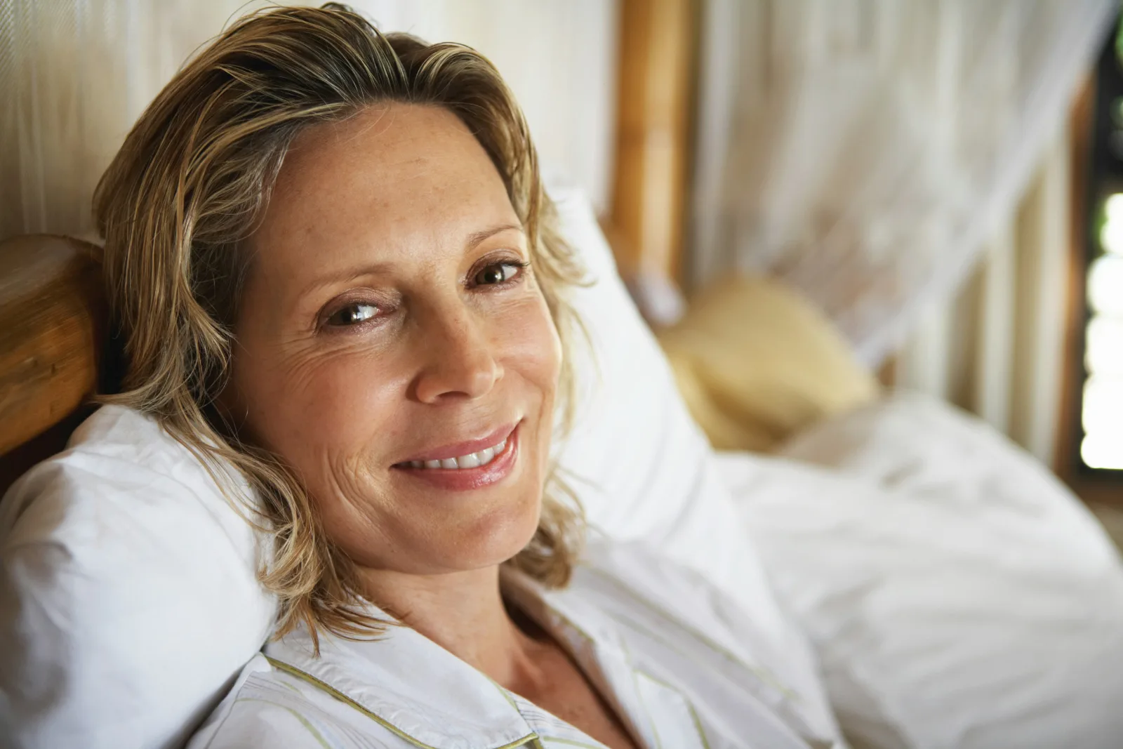 Relaxed woman in her fifties smiling