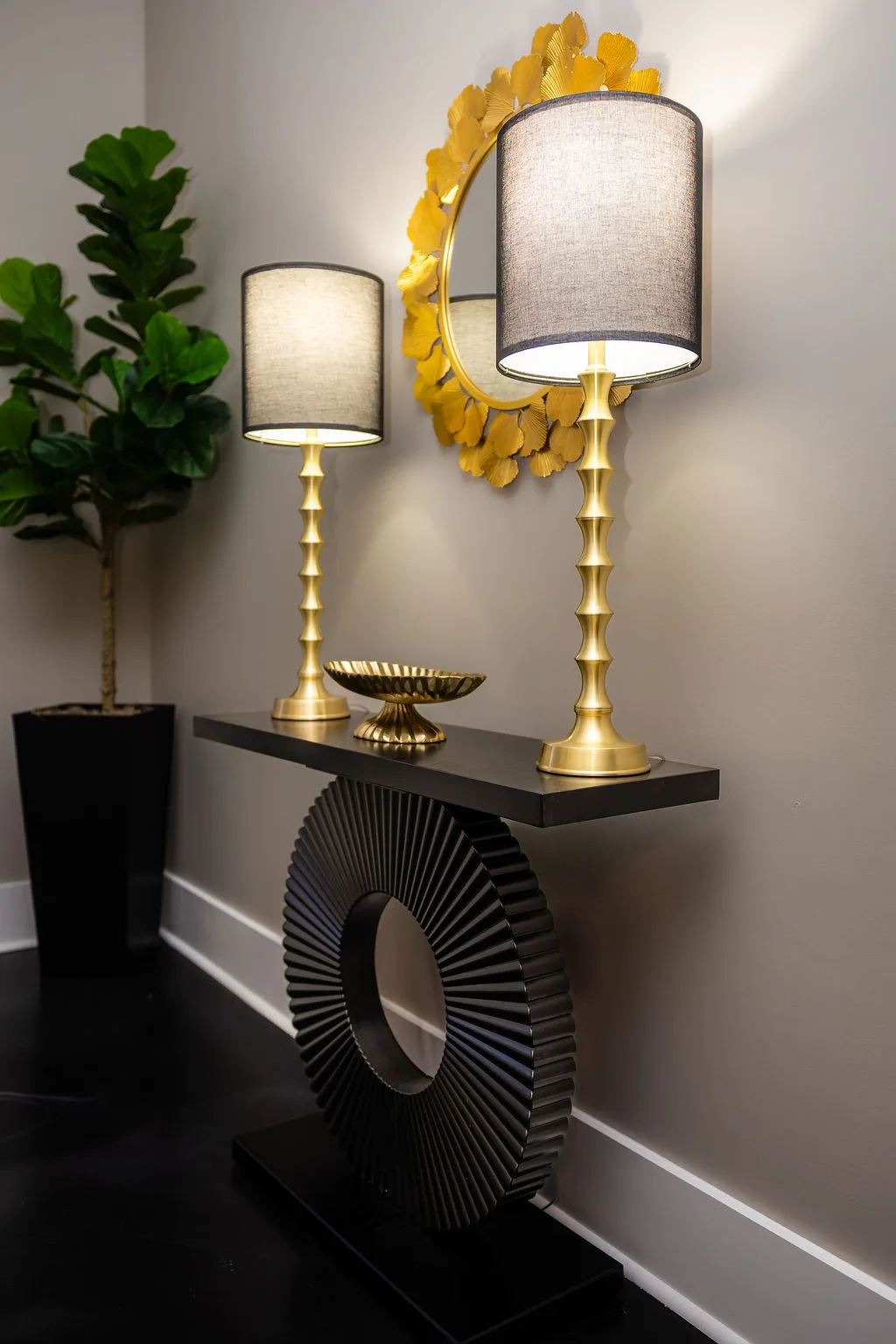 Console table with gold lamps in the Lexel studio