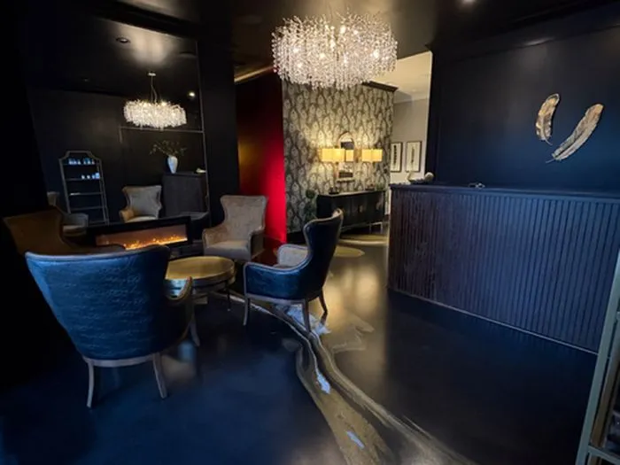 Japanese-style head spa lounge with velvet chairs and chandeliers at Lexel in Dunn, North Carolina