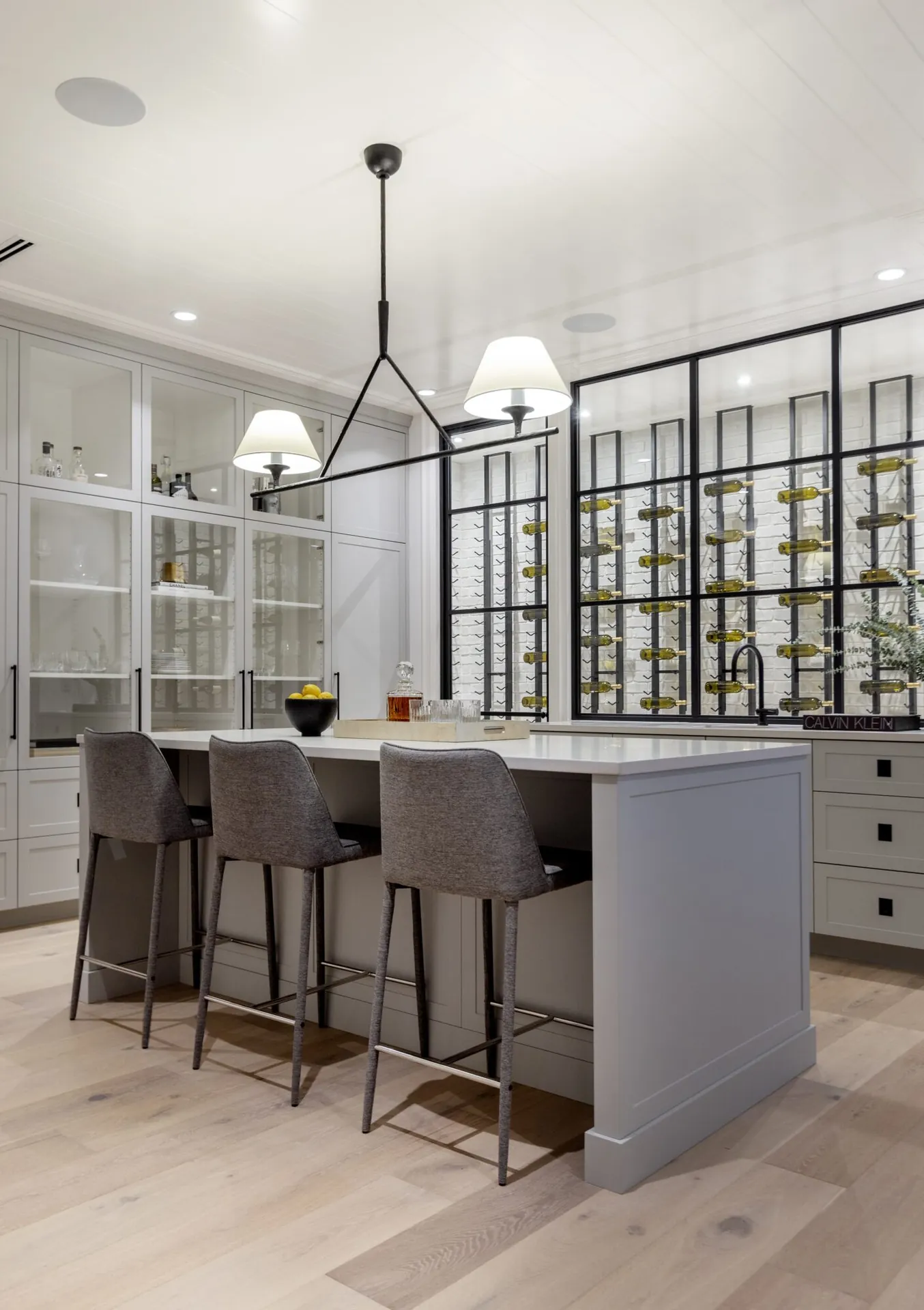 Kitchen island and glass cabinet painting in the Bartlett custom home, Langley