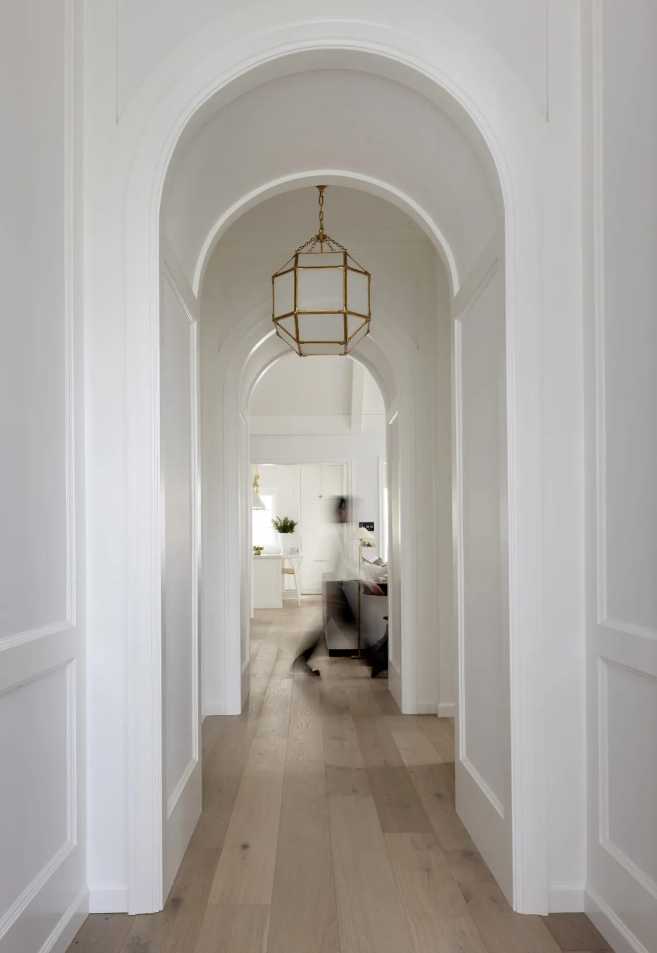 Arched hallway interior painting in the Bartlett custom home, Langley