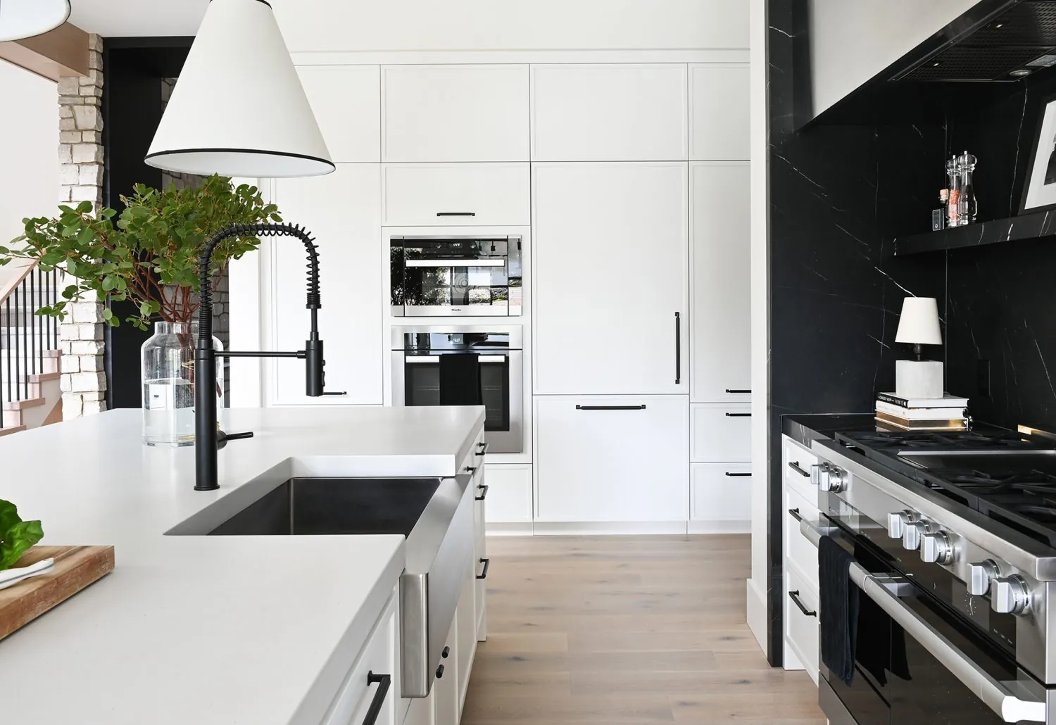 White kitchen cabinet painting in the Ferme Moderne custom home