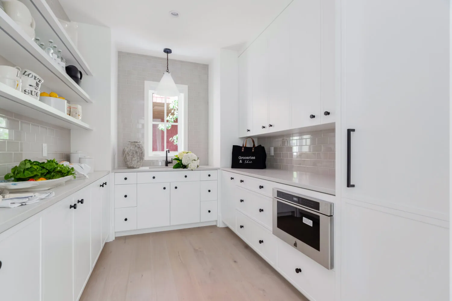 Butler's pantry white cabinet painting in the Glover custom home
