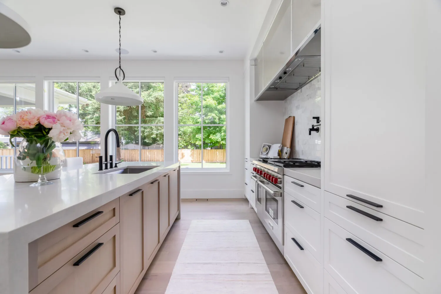 White kitchen cabinet painting in the Glover custom home