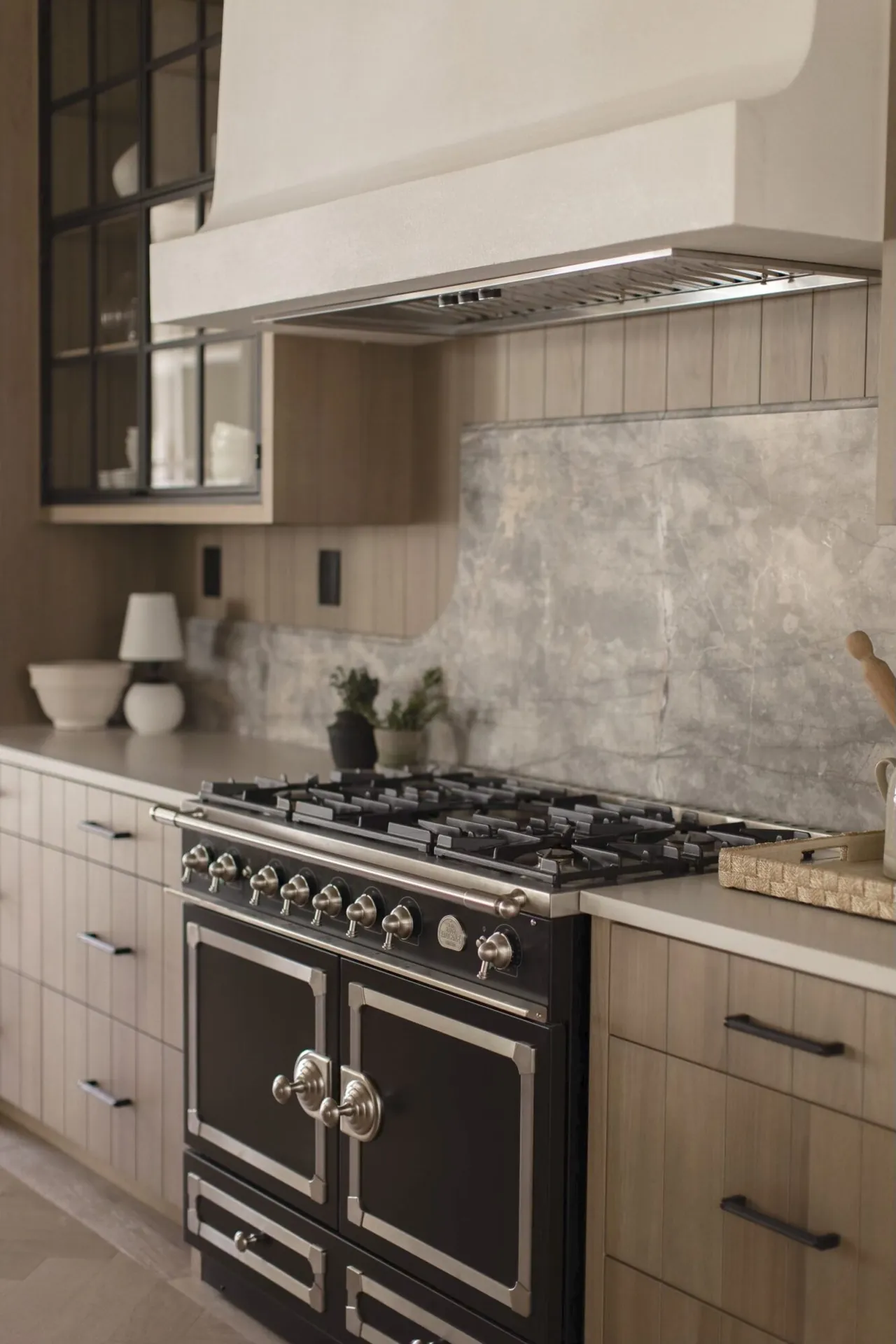 Kitchen range wall and cabinet painting in the Grove custom home by Shaan Painting