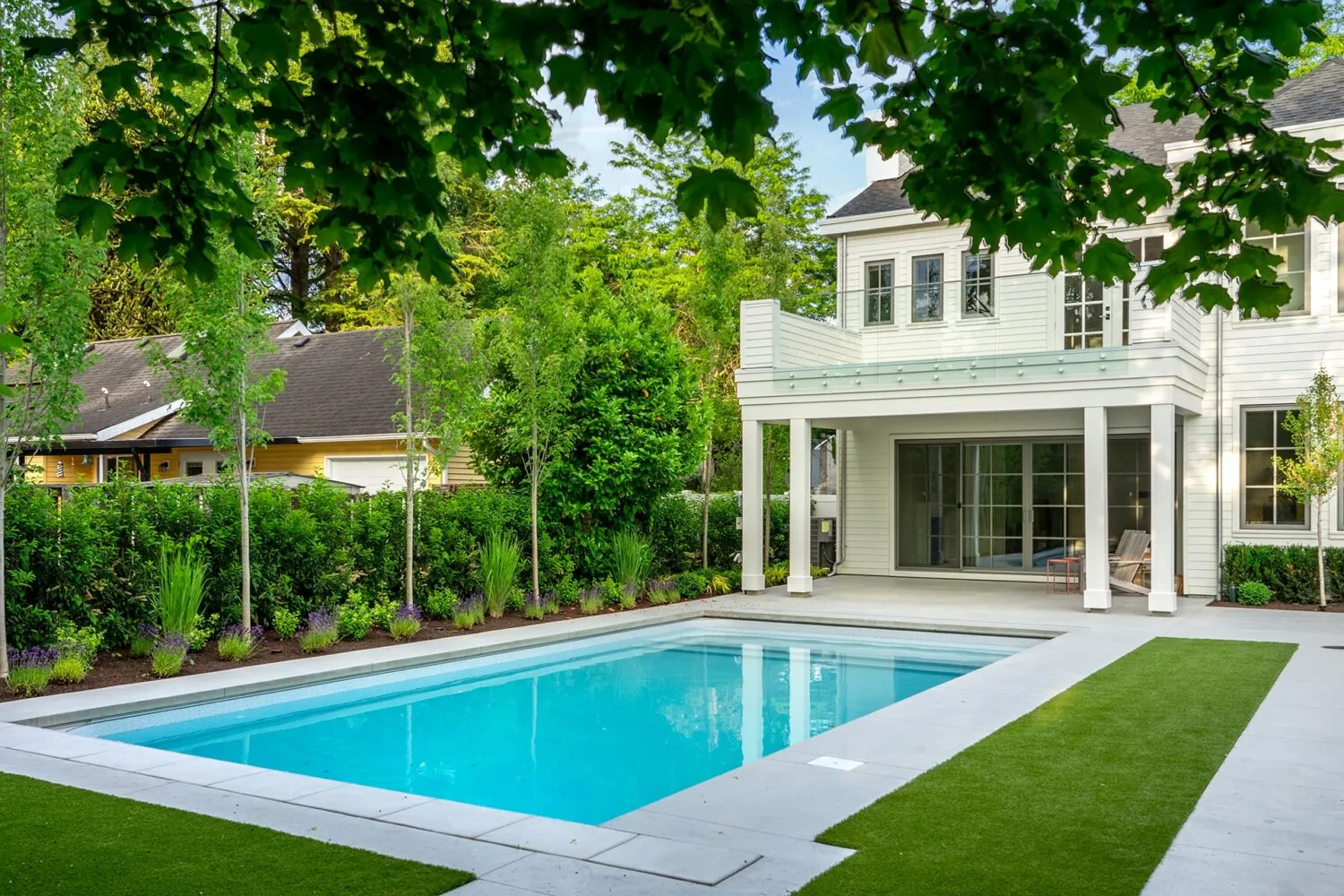 Backyard pool and exterior painting of the Jeffrey custom home
