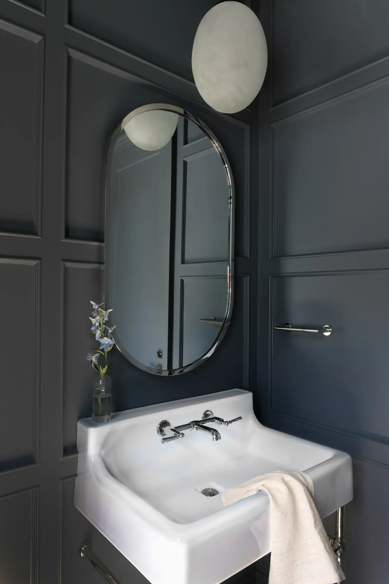 Dark panelled powder room painting in the Noir custom home