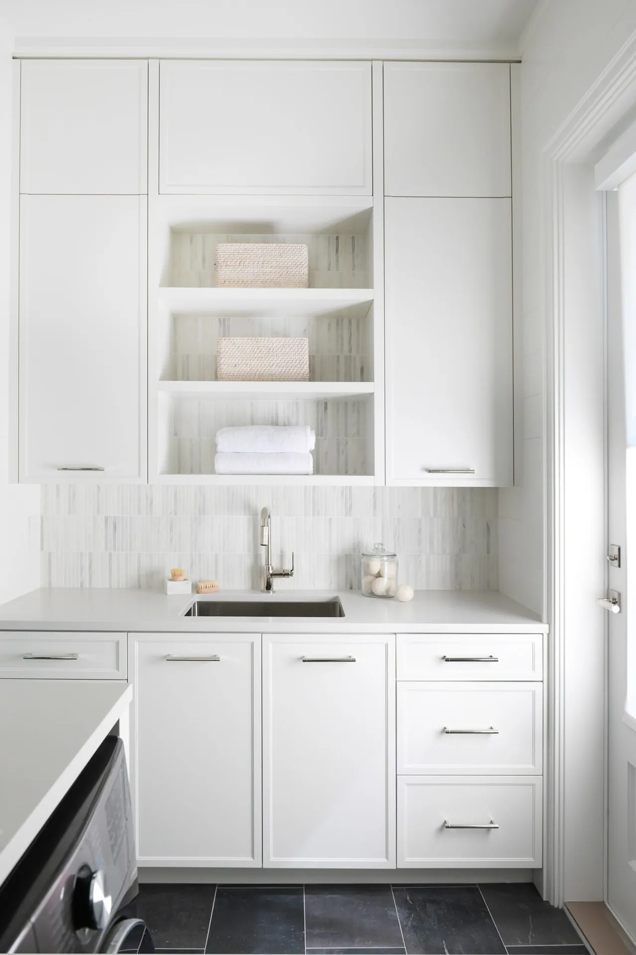 Kitchen with dark cabinet painting in the Noir custom home