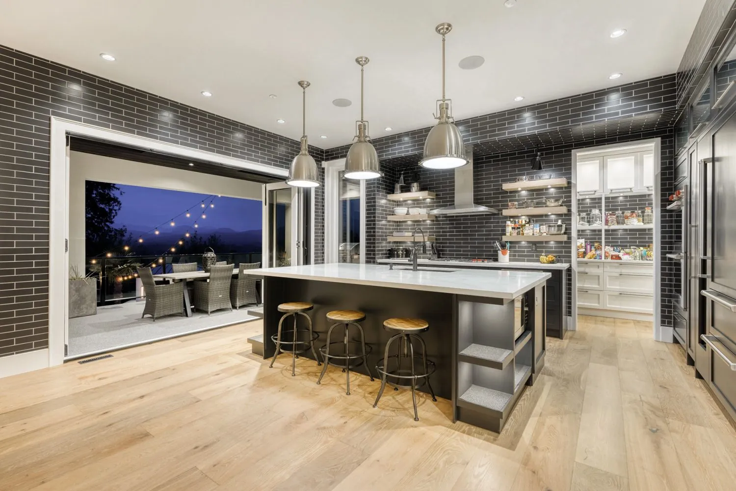 Kitchen with dark island and interior painting in the Palm custom home