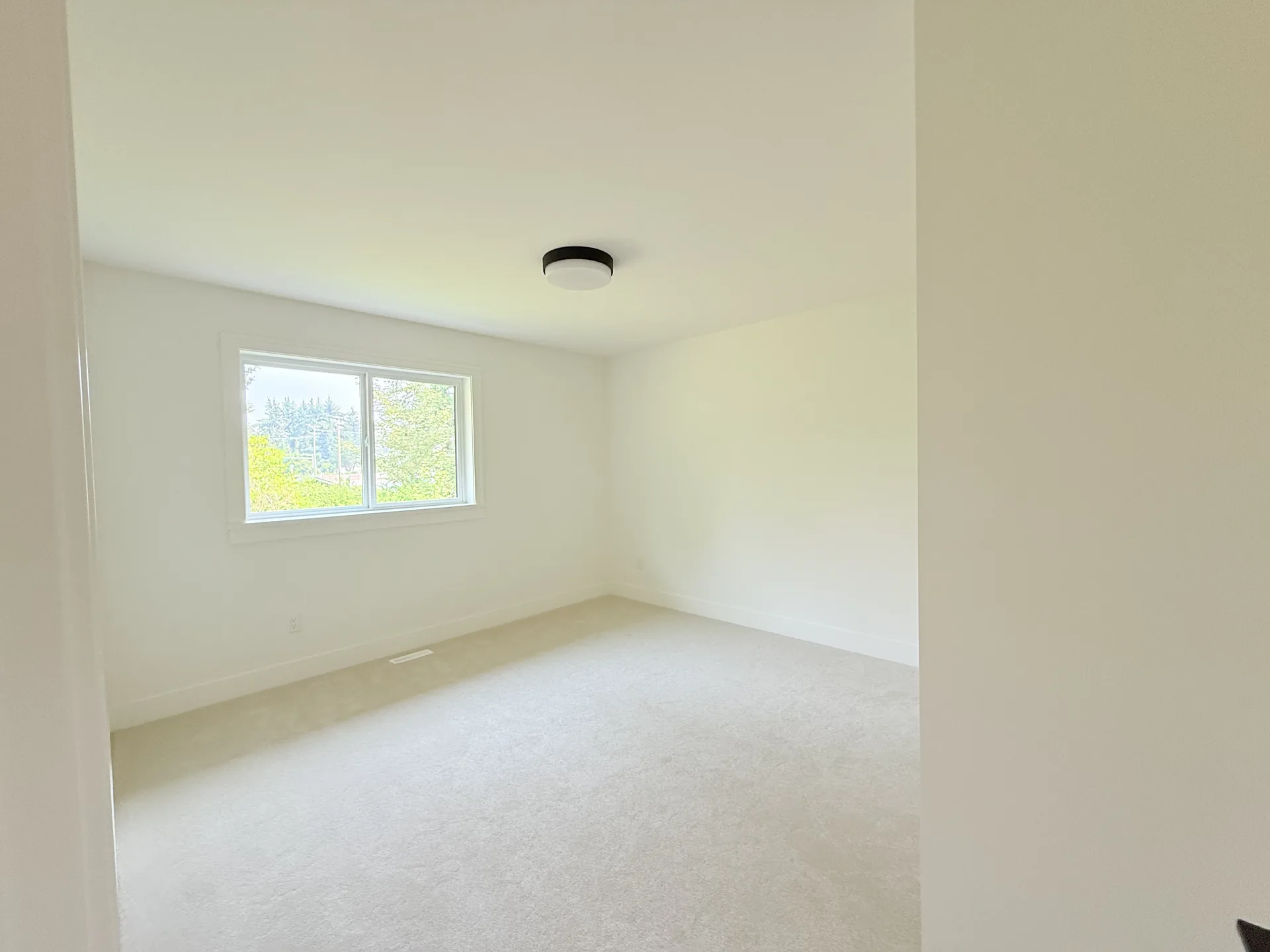 Bedroom with fresh white walls and trim