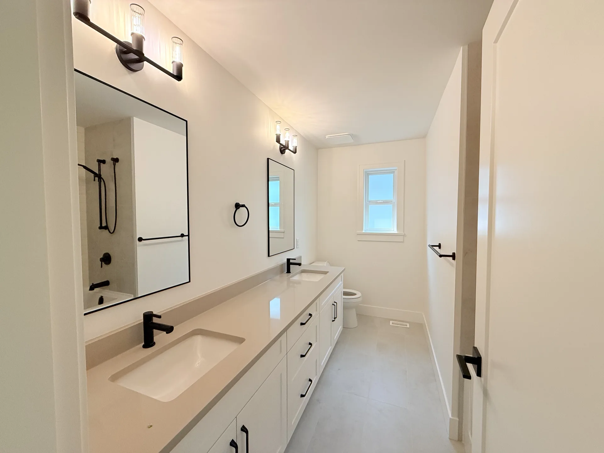 Bathroom vanity with crisp white painted walls