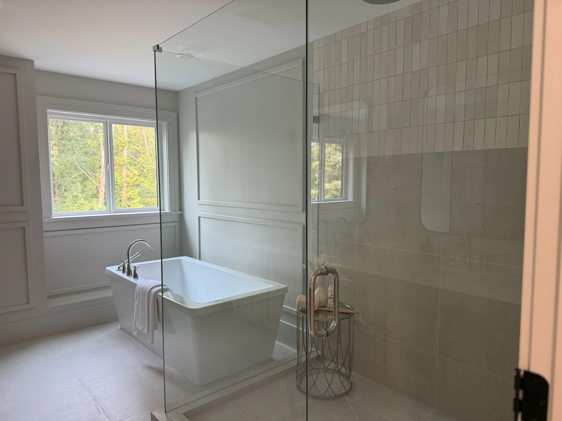 Ensuite soaker tub and glass shower, freshly painted walls