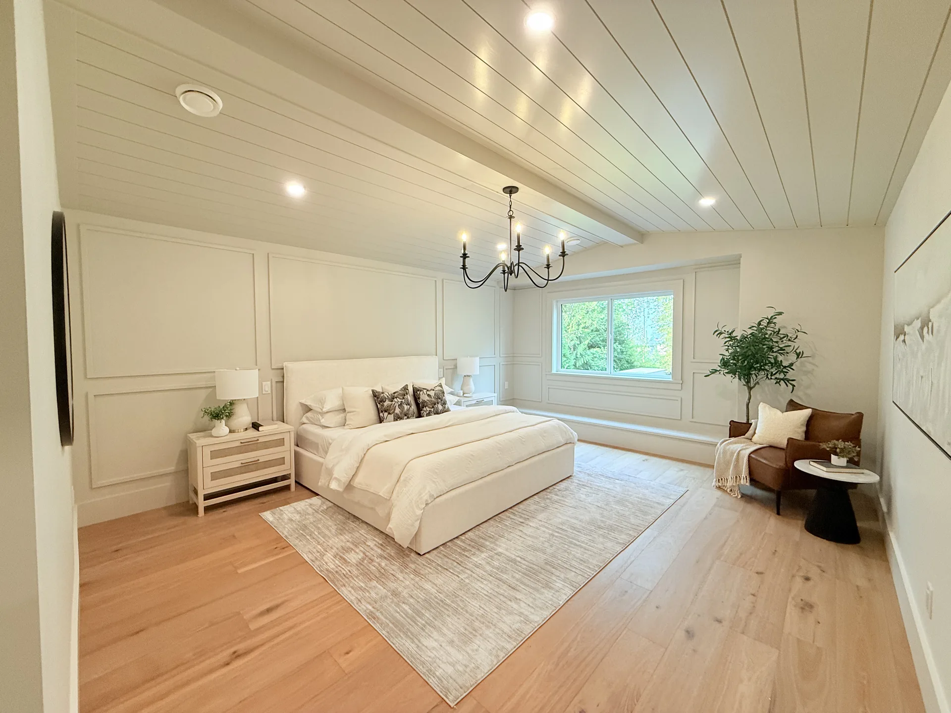 Primary bedroom shiplap ceiling and wainscoting painted white