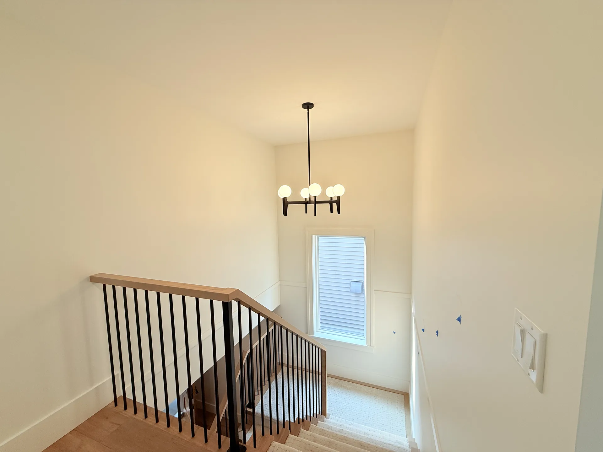 Staircase with painted walls and trim