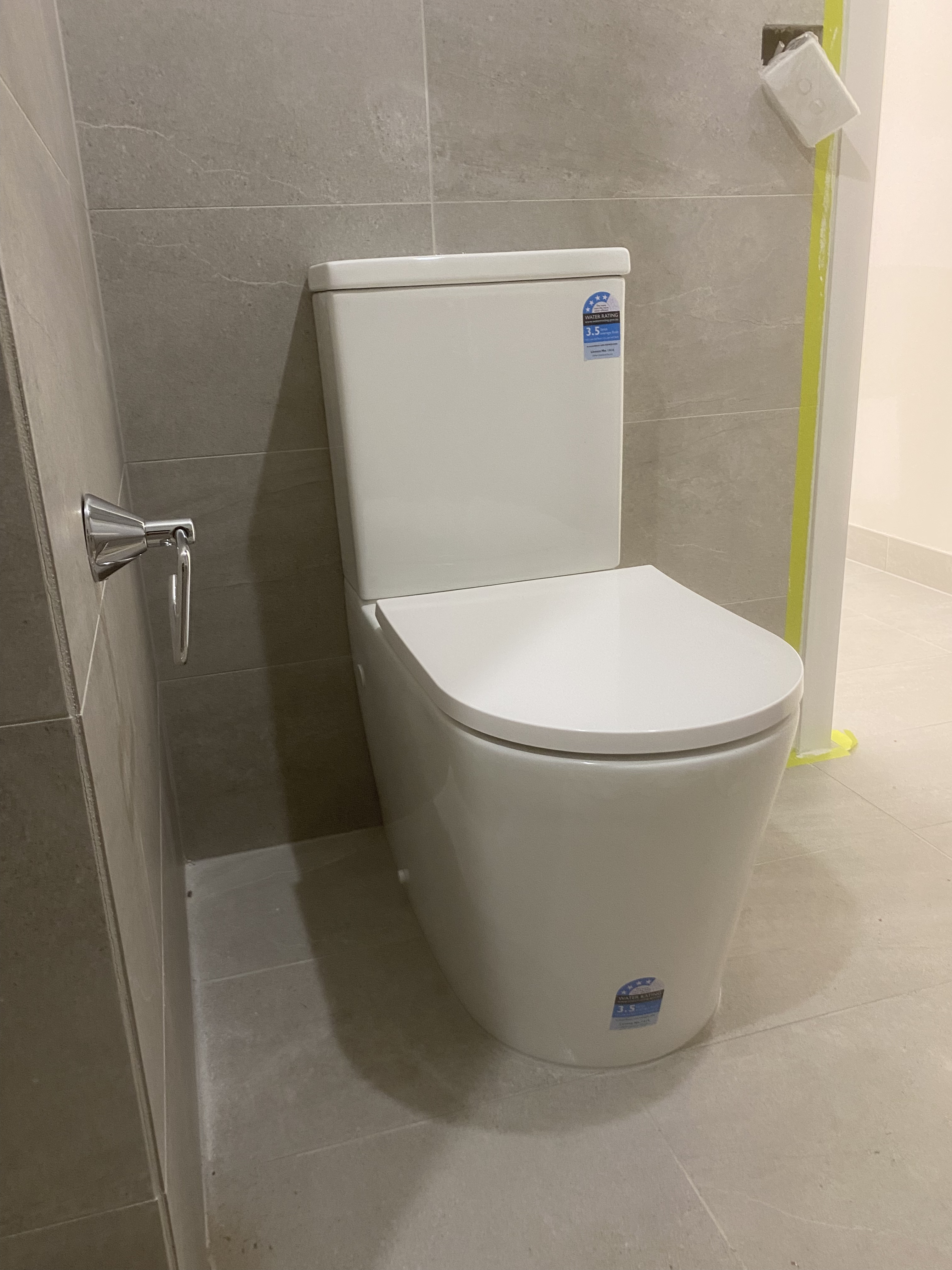 Compact Grey Tile Bathroom Upgrade photo 2