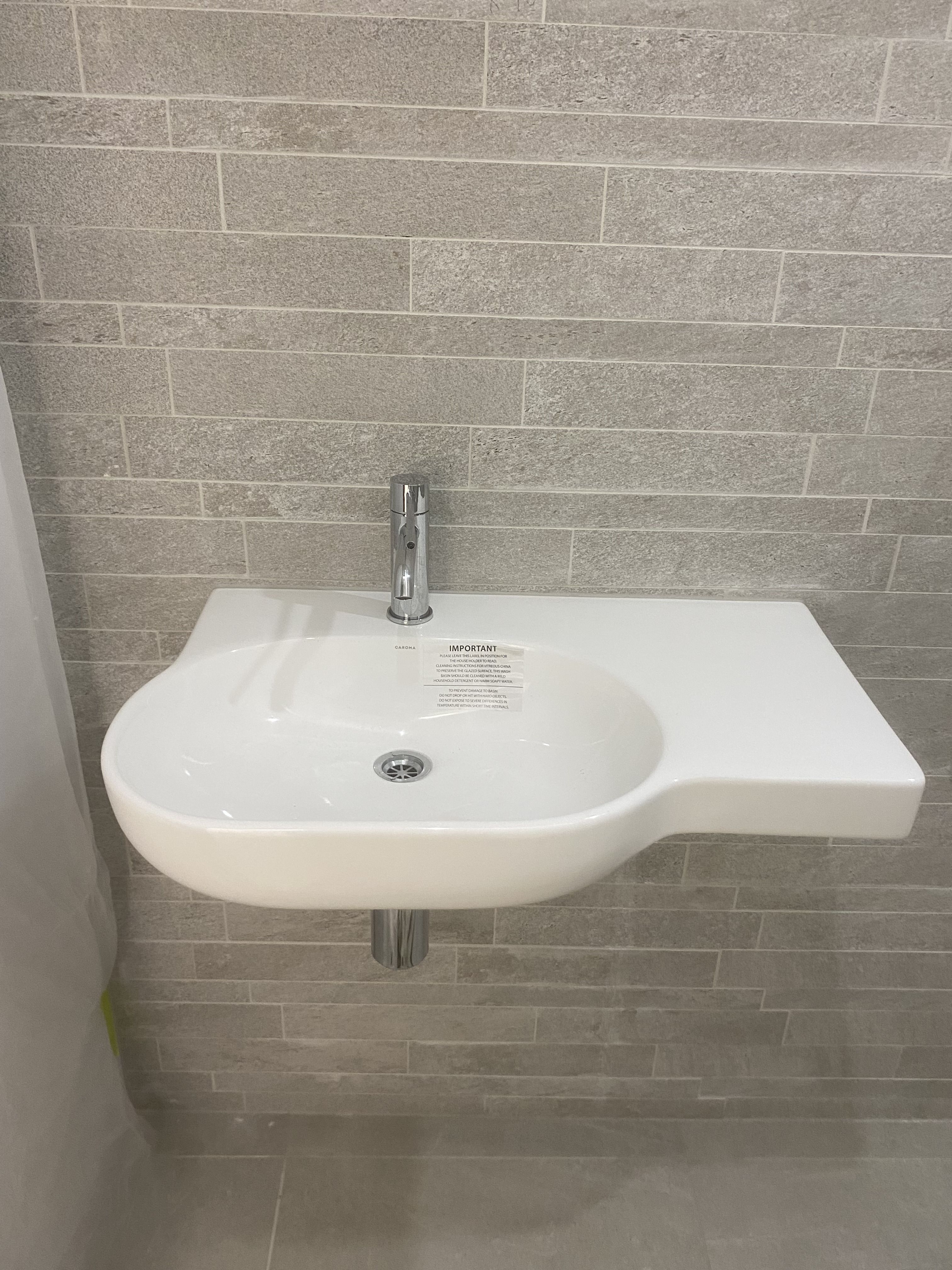 Compact Grey Tile Bathroom Upgrade photo 3