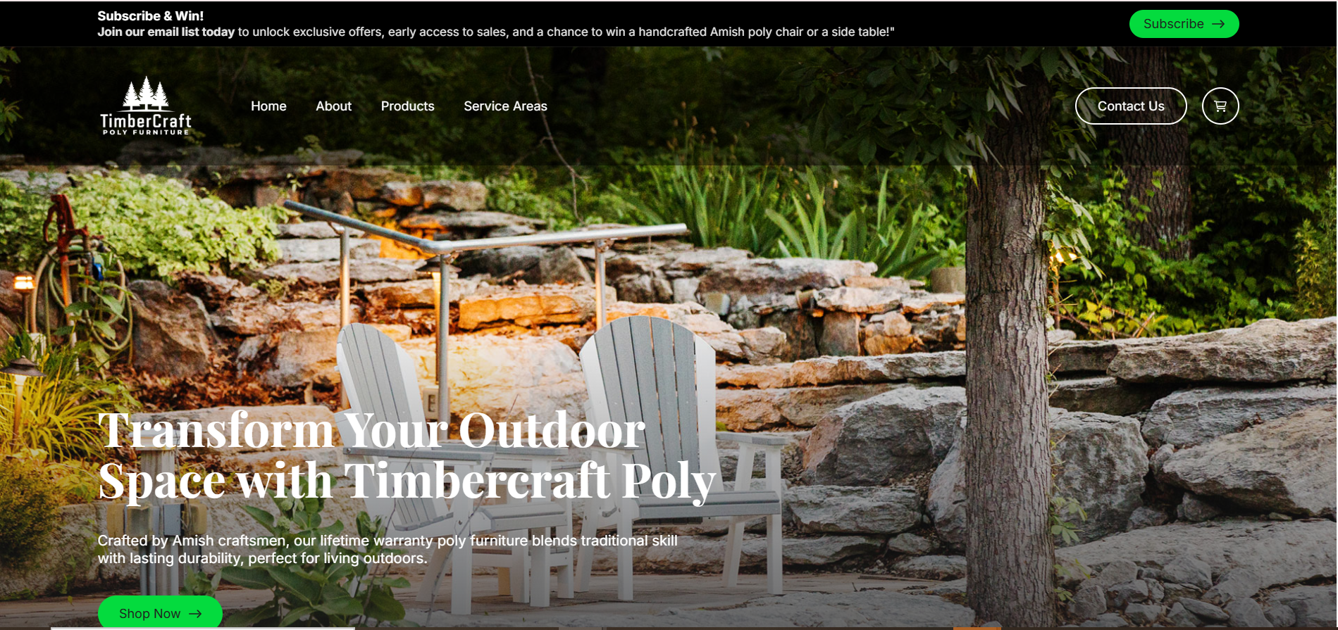Outdoor setting featuring TimberCraft poly furniture, including white Adirondack chairs and a table, surrounded by natural stone and greenery, promoting durable outdoor living solutions.