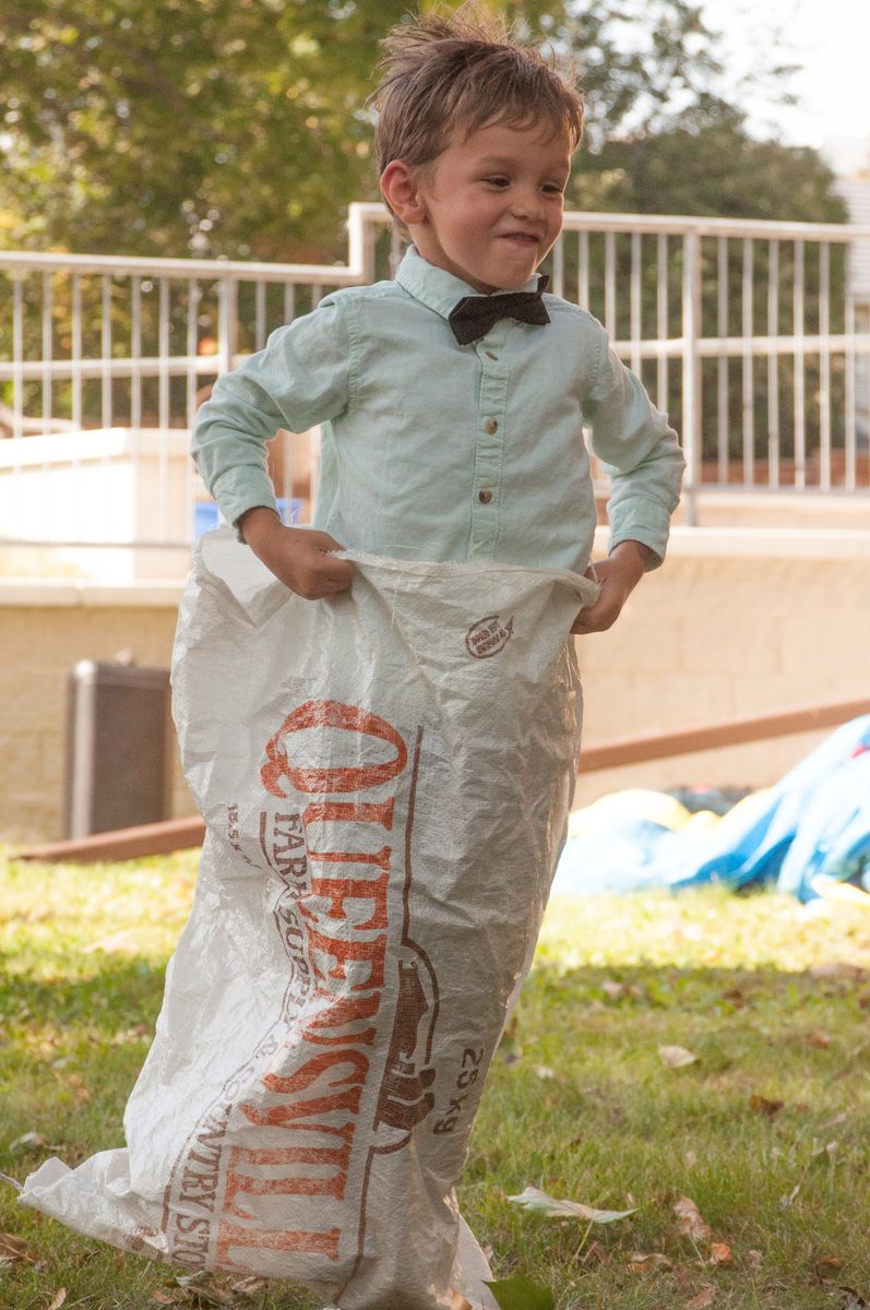 A boy standing in his sack before the race at the fall kick off
