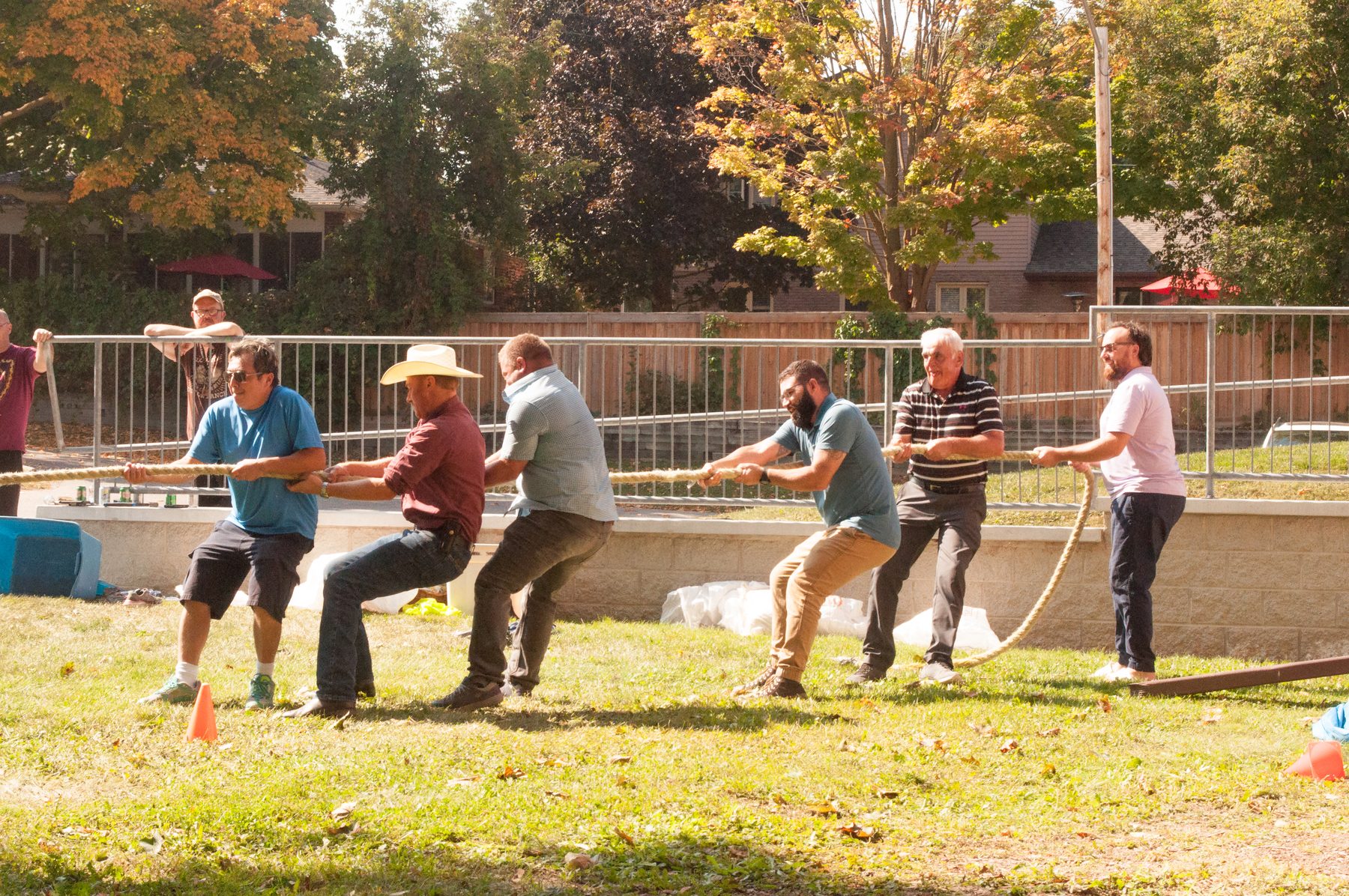 Members of New Hope playing tug of war on the church lawn