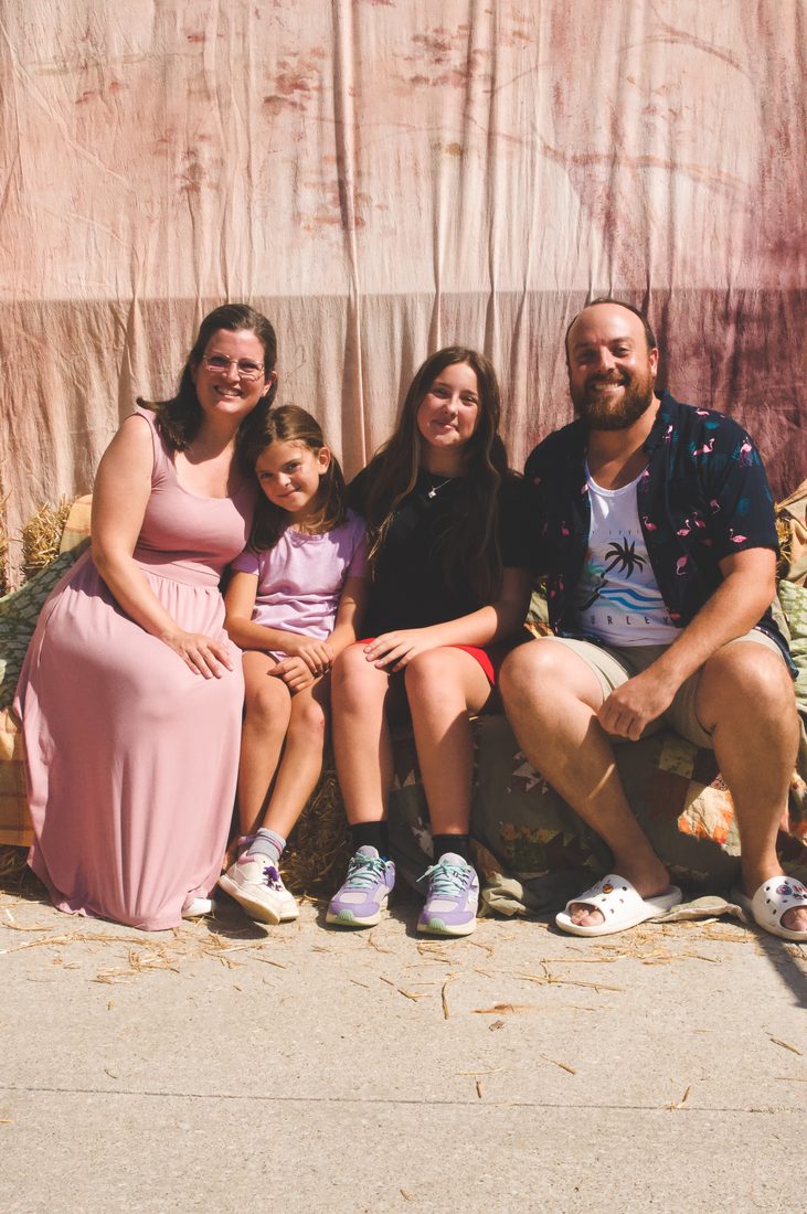 A family of four at the fall kick off