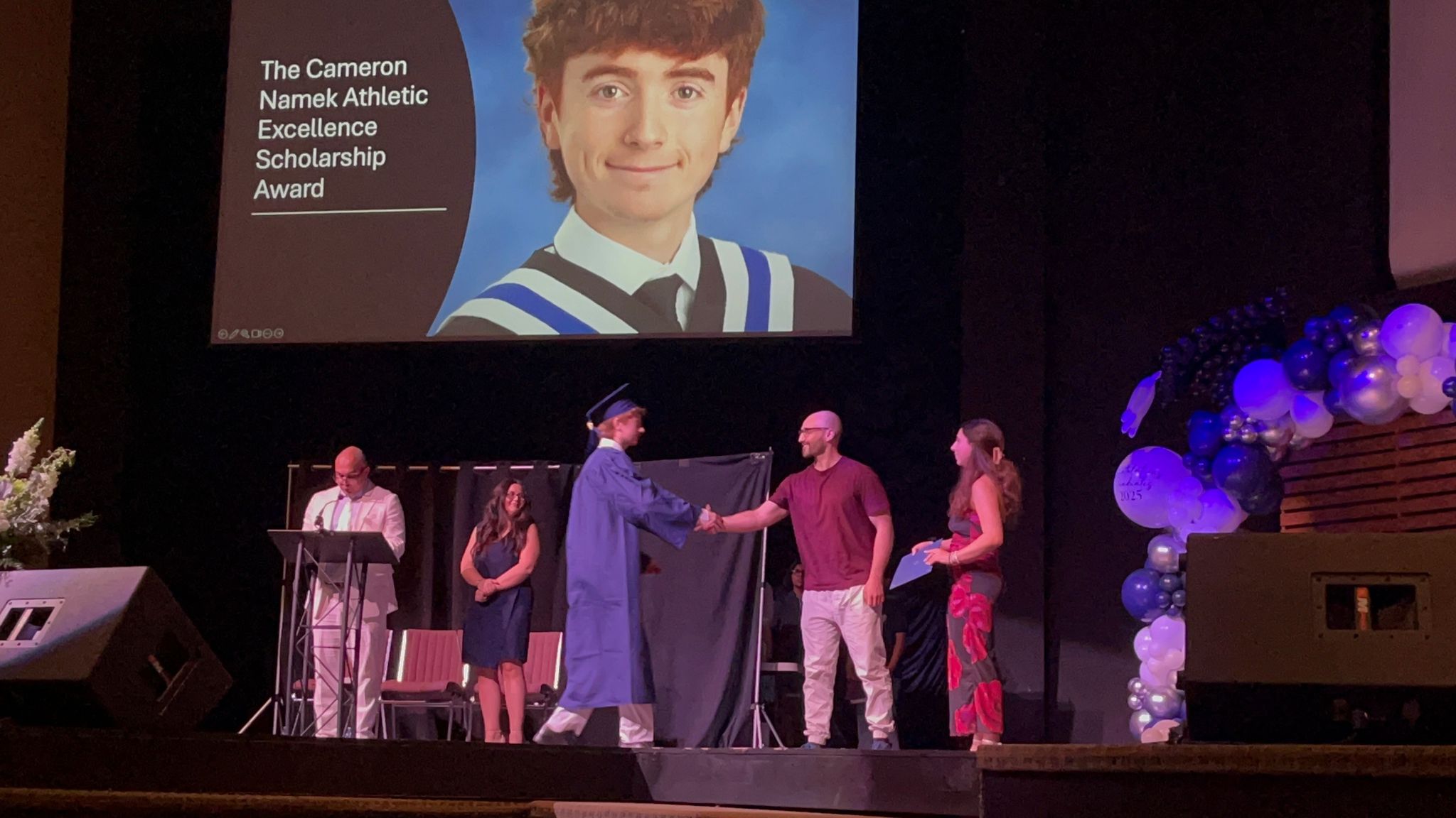 Michael Cappa presenting the Cameron Namek Athletic Excellence Award at St. Mary CSS Pickering