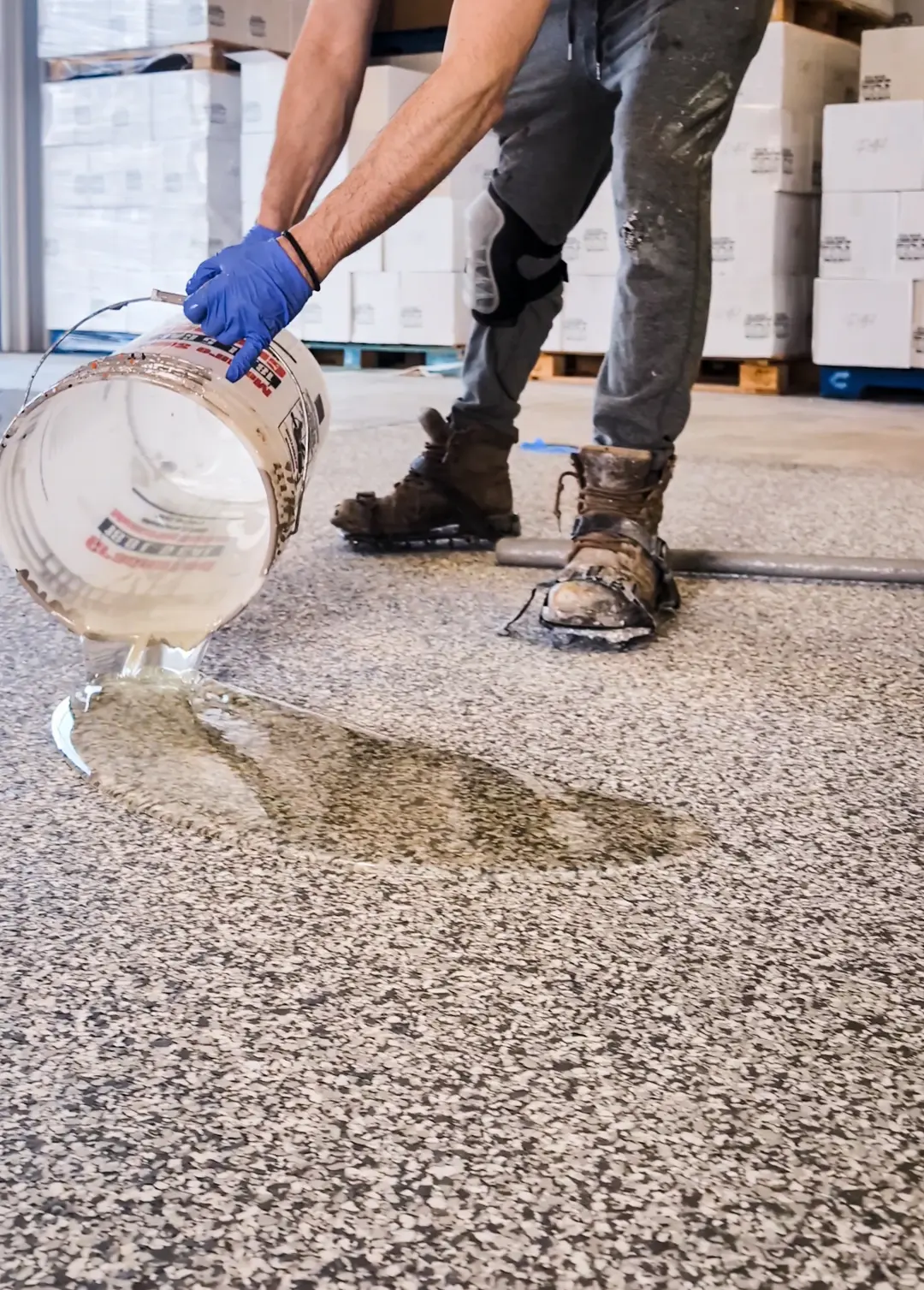 Applying epoxy flake coating to warehouse floor