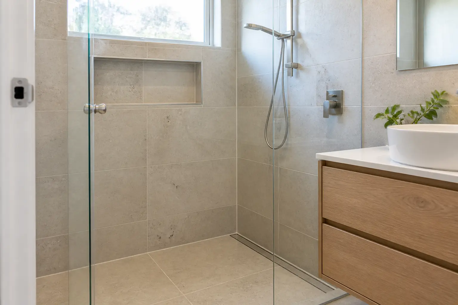 Example tiled shower with restored grout and watertight seals