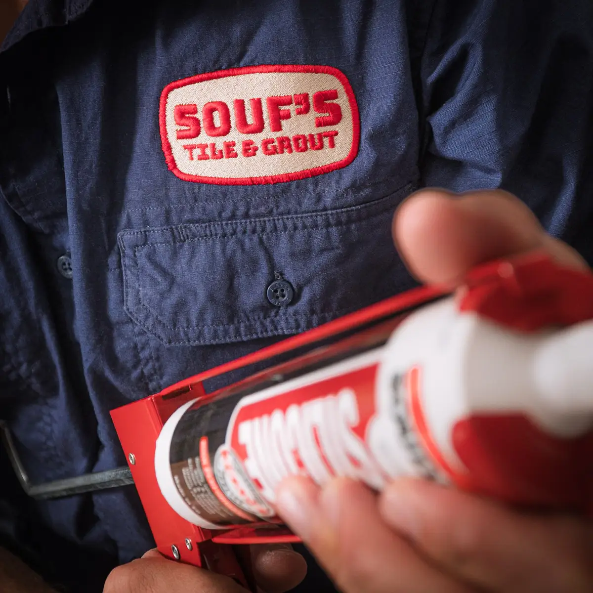 Souf’s Tile & Grout work shirt and silicone application gun