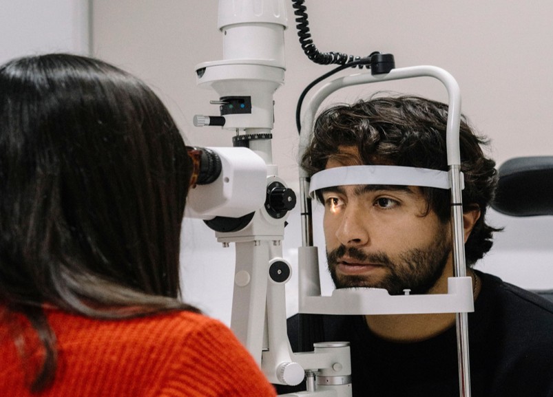 Patient undergoing an eye exam before a DMV vision test