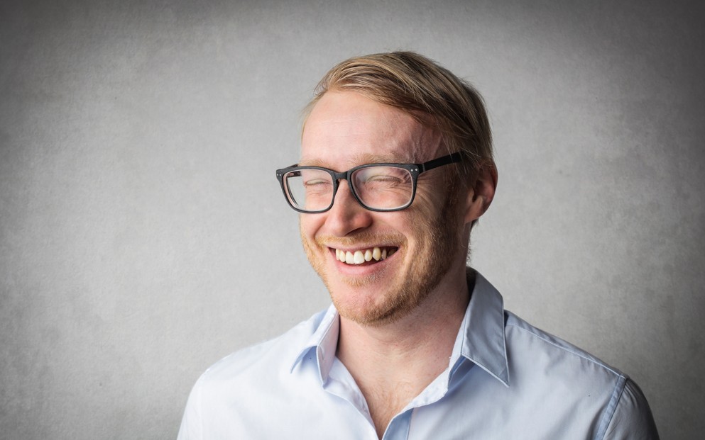 Happy man wearing glasses with multifocal lenses Happy man wearing glasses with multifocal lenses