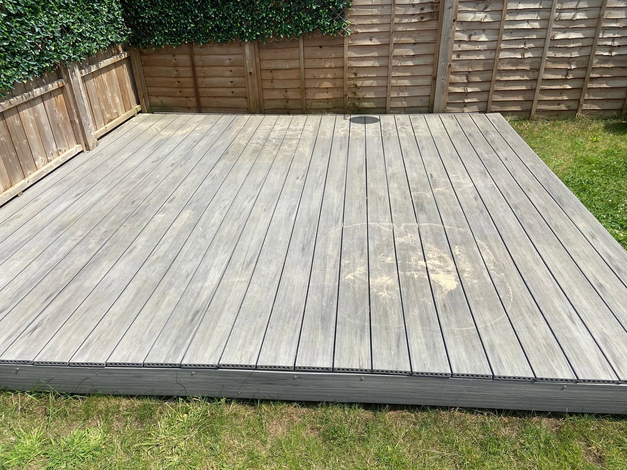 Timber decking in Gloucester with algae buildup before cleaning and restoration by Glevum Hydro
