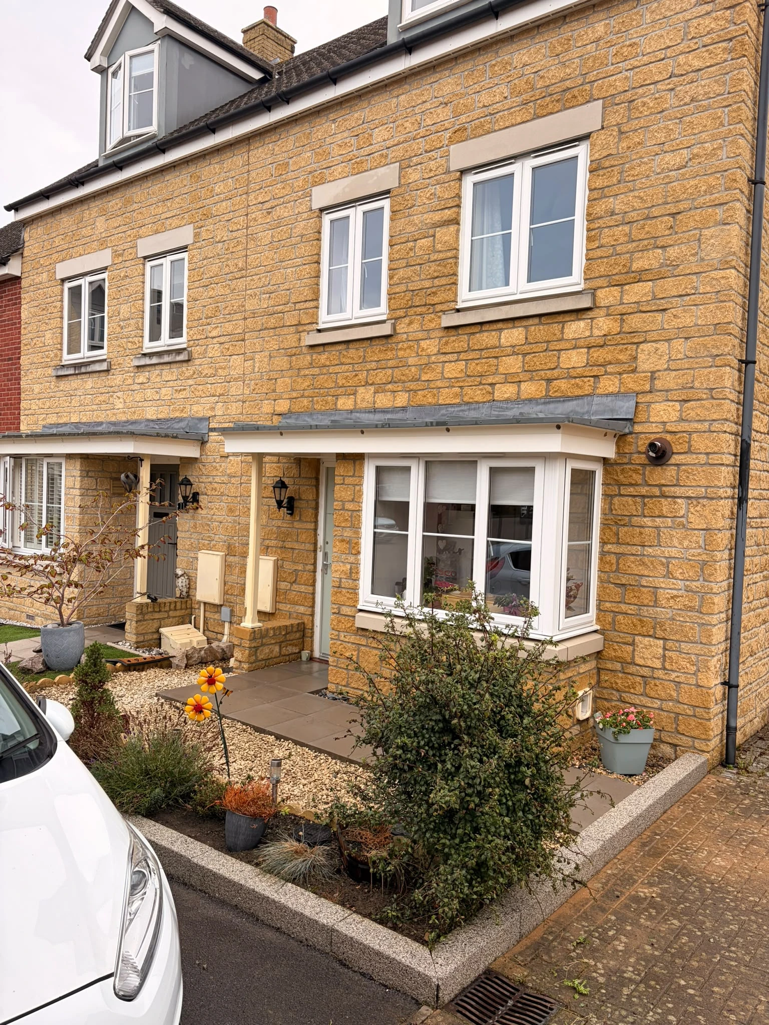 Limestone house in Gloucester after professional soft washing restoring the natural stone by Glevum Hydro