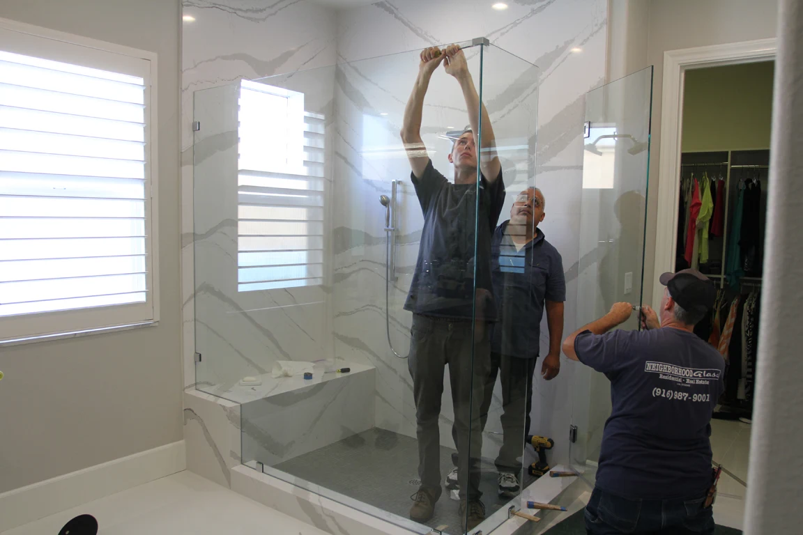 Neighborhood Glass & Screen team installing a custom shower glass panel in Rocklin, CA