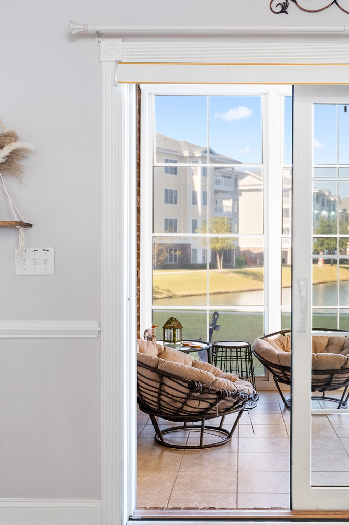 woman setting sheets on bed