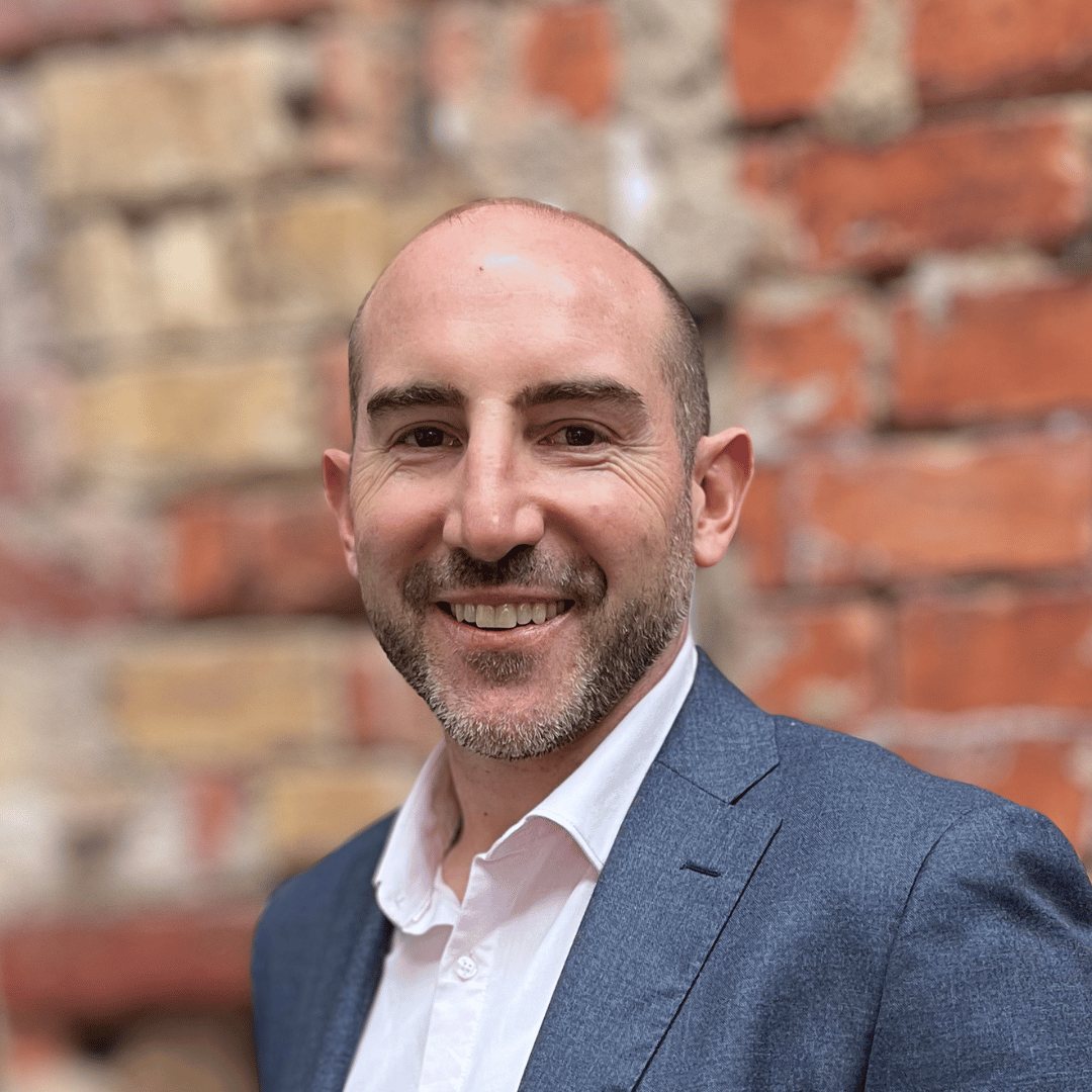 Headshot of Barry Morris against a brick wall
