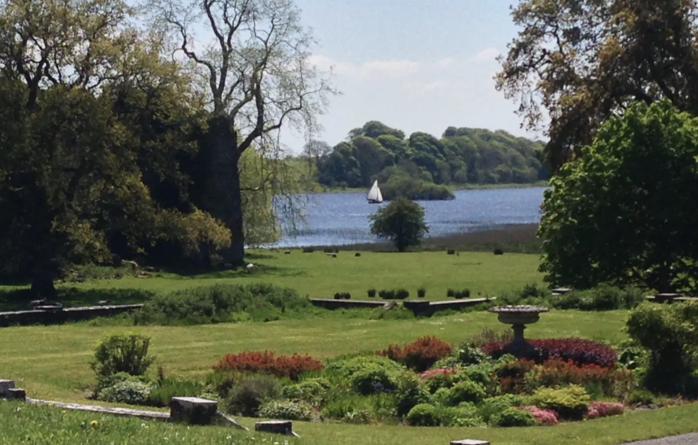 Lake with sailboat at Temple House