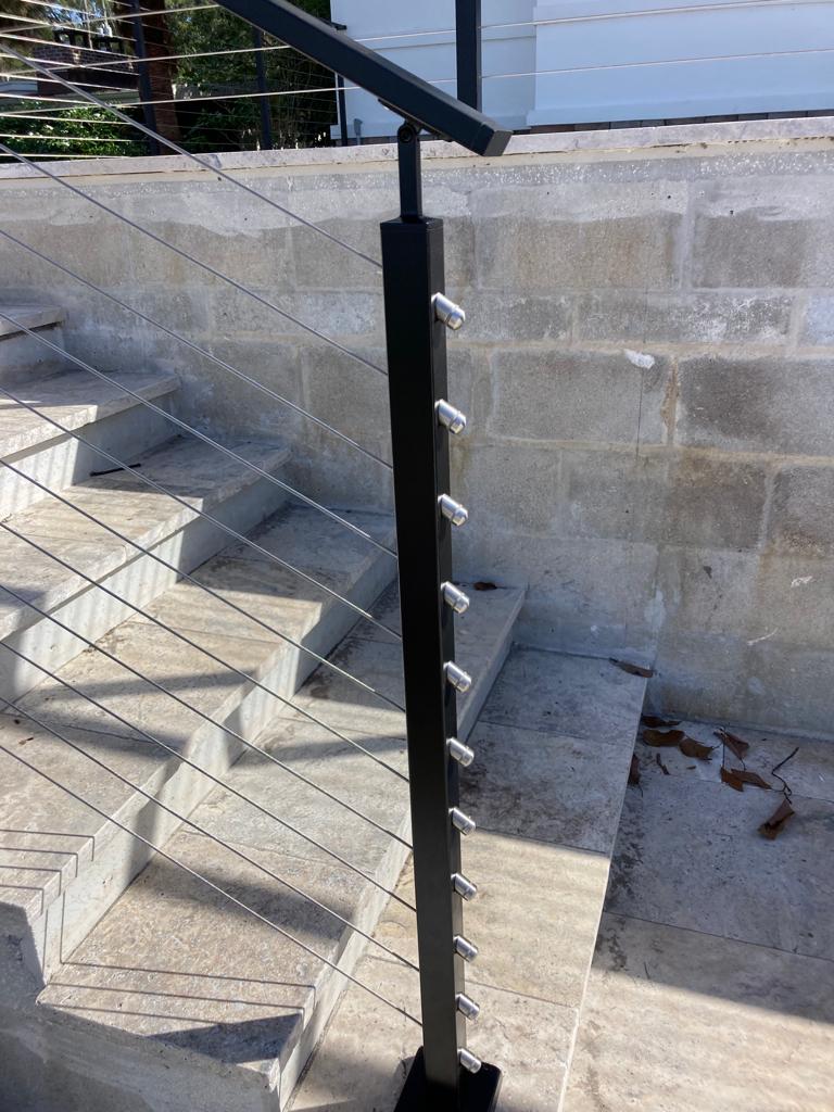 Architectural cable railing installed on a coastal Florida property by Railing Max