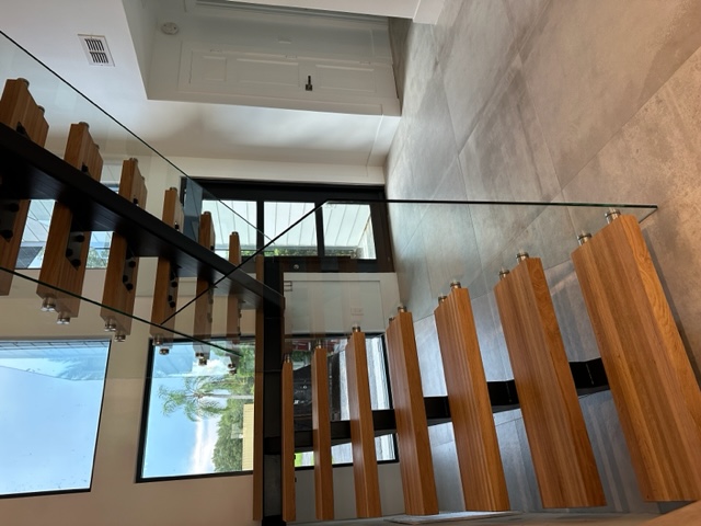 Floating stair and guard system built as one assembly by Railing Max in Florida