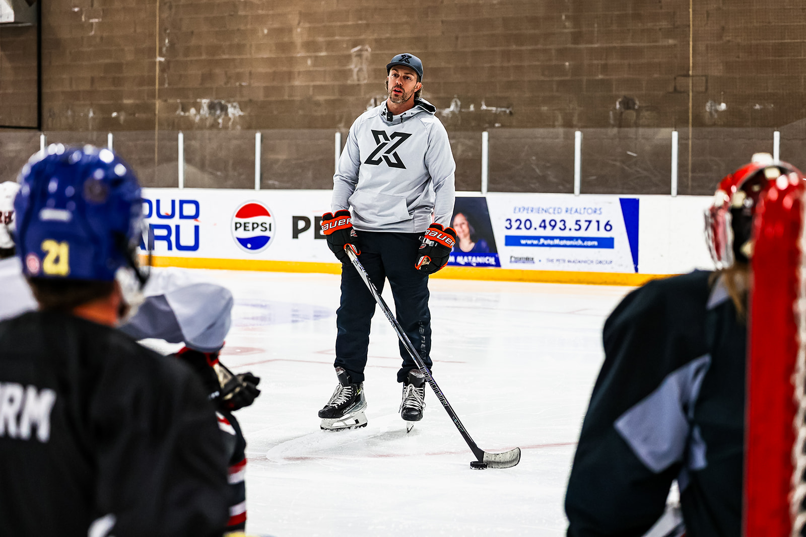 John Swanson coaching on ice at X7 Hockey